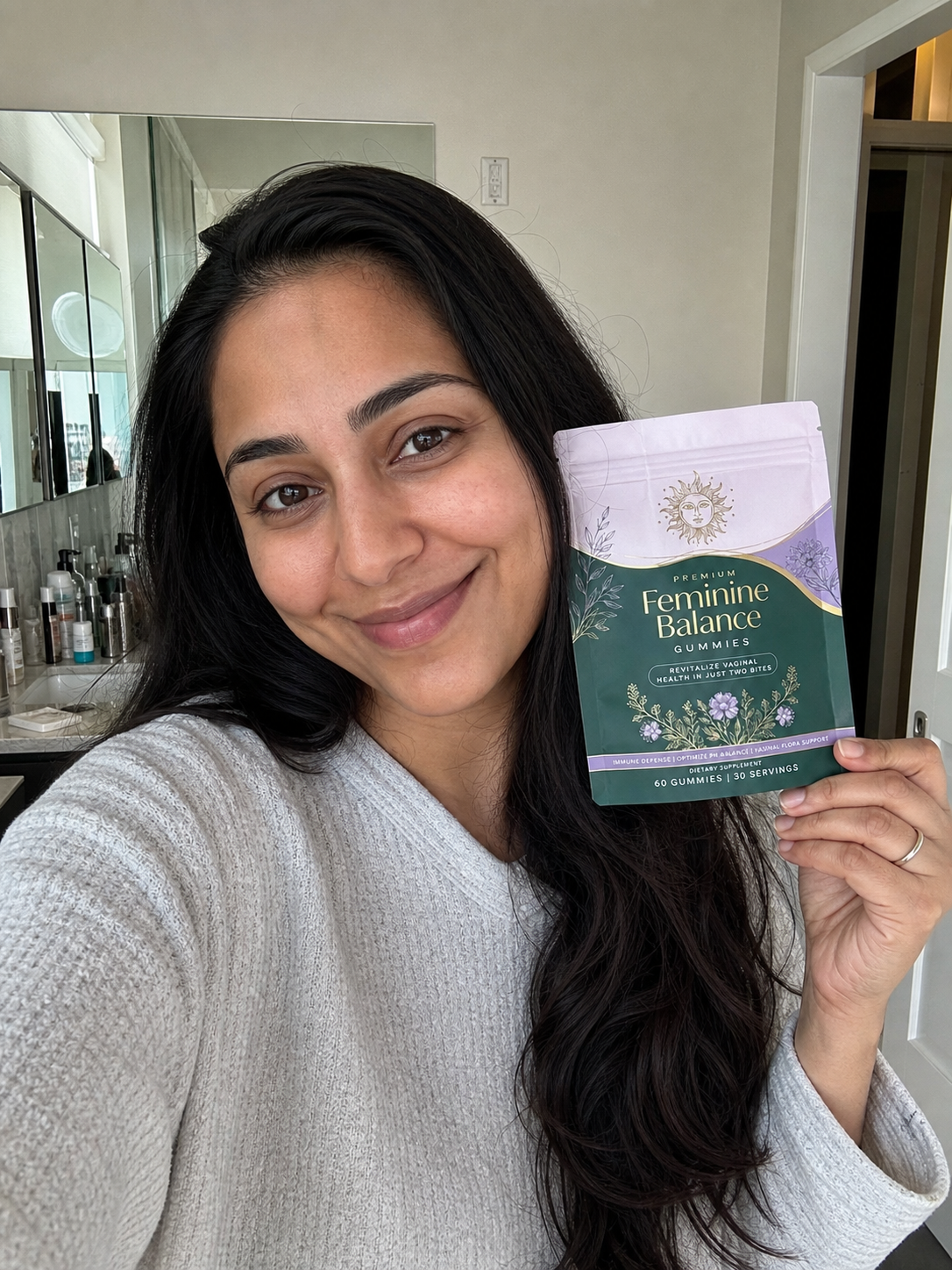 Woman holding Feminin Gummies by Beauty Kiwi
